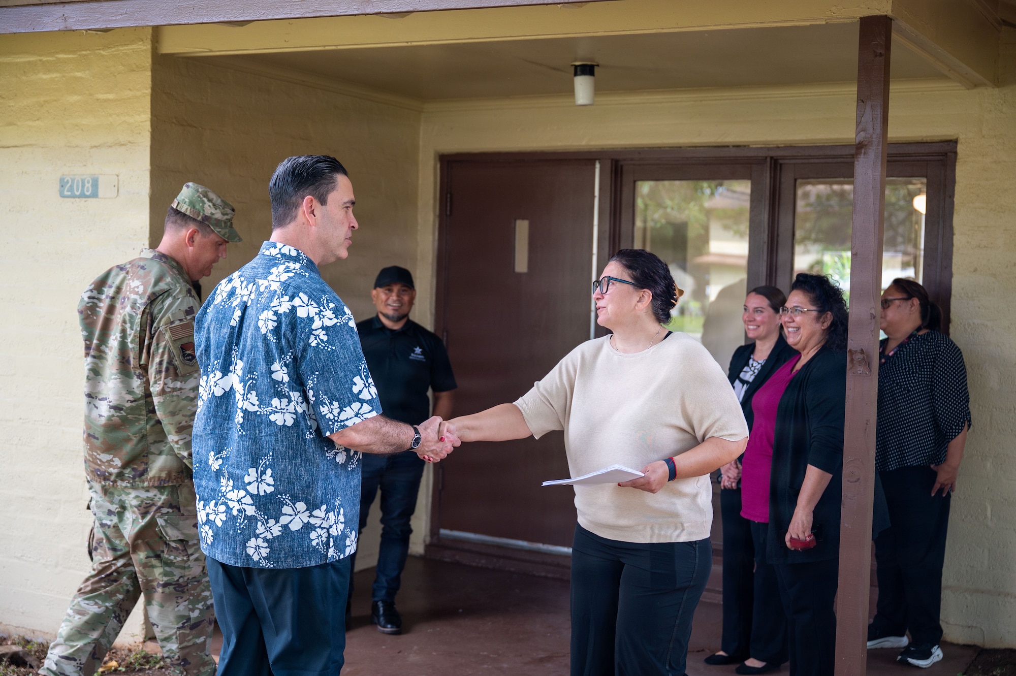 The Honorable Michael Borders, U.S. Assistant Secretary of the Air Force for Energy, Installations and Environment, greets military housing staff during an immersion tour of historical base lodging at Joint Base Pearl Harbor-Hickam.