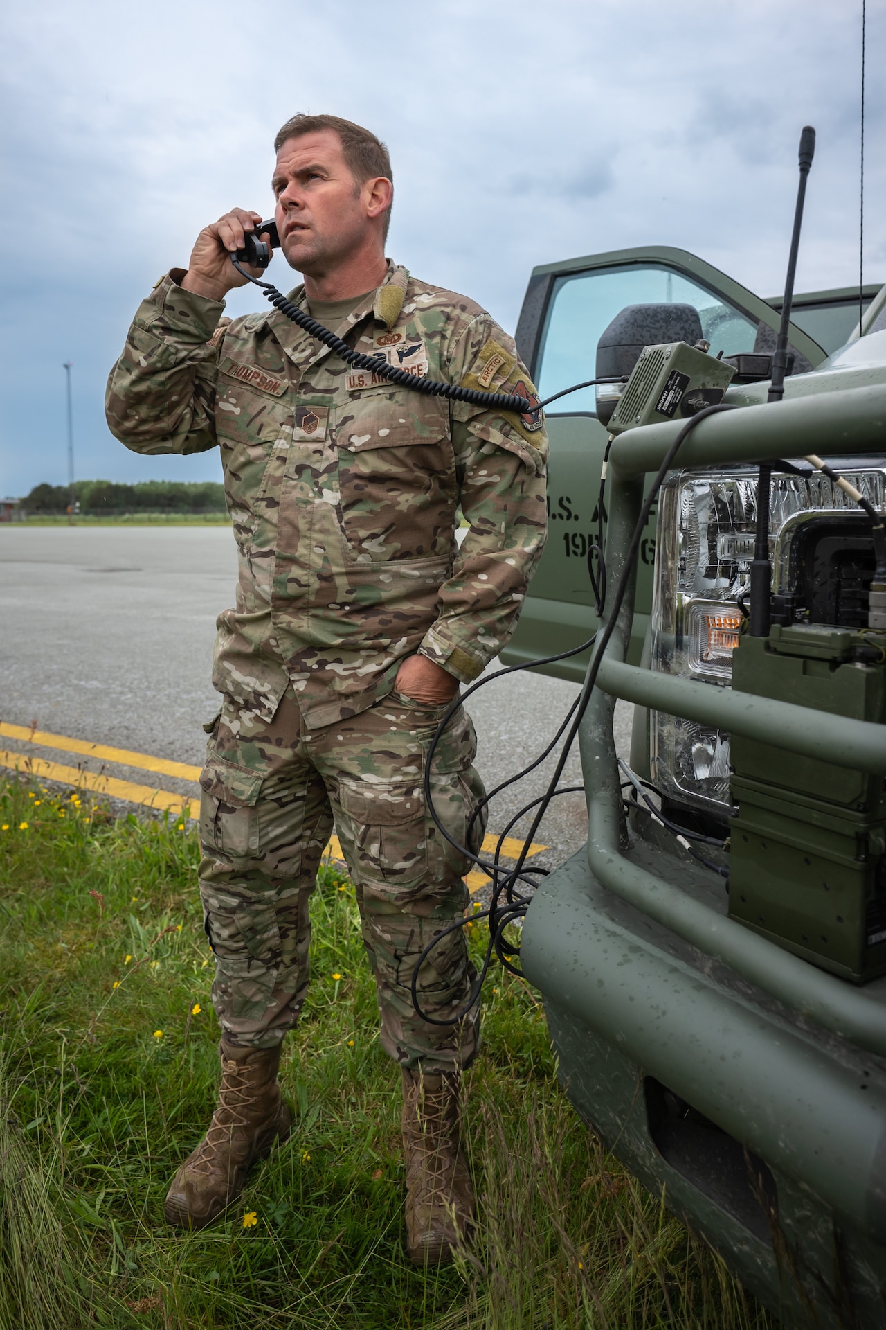 U.S. Air Force Master Sgt. Ryan Thompson, an airfield manager with the 123rd Airlift Wing, Kentucky Air National Guard, communicates with an aircraft arriving at Sindal Airport in Sindal, Denmark, June 3, 2026, as part of a search-and-recovery training scenario with members of the Danish Armed Forces. The 123rd AW is providing tactical airlift support to NATO Allies throughout the month of June in support of Ramstein Flag 2026, an Allied Air Command large-scale, air-focused, multi-location and joint operating area exercise with 18 participating nations and more than 200 aircraft. (U.S. Air National Guard photo by Lt. Col. Dale Greer)