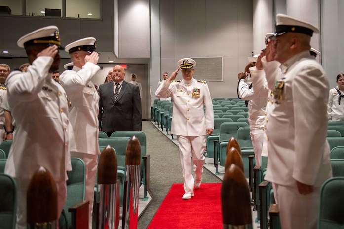 260604-N-MZ309-1023 KEYPORT, Wash. (June 4, 2026) Capt. Lacy Lodmell arrives to a change of command ceremony at the U.S. Naval Undersea Museum in Keyport, Washington, June 4, 2026. During the ceremony Lodmell relieved Capt. Rob Garis as commodore of Submarine Squadron (CSS) 19. CSS-19 is subordinate to Commander, Submarine Group (SUBGRU) 9 which exercises administrative and operational control of assigned submarine commands and units in the Pacific Northwest, providing oversight for shipboard training, personnel, and the supply and material readiness of SSBNs and their crews. SUBGRU-9 is also responsible for nuclear submarines undergoing conversion or overhaul at Puget Sound Naval Shipyard in Bremerton. (U.S. Navy photo by Mass Communication Specialist 1st Class Ryan Riley)