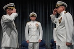 260604-N-MZ309-1177 KEYPORT, Wash. (June 4, 2026) Capt. Lacy Lodmell relieves Capt. Rob Garis as commodore of Submarine Squadron (CSS) 19 during a change of command ceremony at the U.S. Naval Undersea Museum in Keyport, Washington, June 4, 2026. CSS-19 is subordinate to Commander, Submarine Group (SUBGRU) 9 which exercises administrative and operational control of assigned submarine commands and units in the Pacific Northwest, providing oversight for shipboard training, personnel, and the supply and material readiness of SSBNs and their crews. SUBGRU-9 is also responsible for nuclear submarines undergoing conversion or overhaul at Puget Sound Naval Shipyard in Bremerton. (U.S. Navy photo by Mass Communication Specialist 1st Class Ryan Riley)