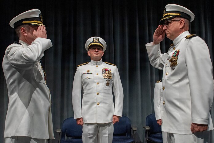 260604-N-MZ309-1177 KEYPORT, Wash. (June 4, 2026) Capt. Lacy Lodmell relieves Capt. Rob Garis as commodore of Submarine Squadron (CSS) 19 during a change of command ceremony at the U.S. Naval Undersea Museum in Keyport, Washington, June 4, 2026. CSS-19 is subordinate to Commander, Submarine Group (SUBGRU) 9 which exercises administrative and operational control of assigned submarine commands and units in the Pacific Northwest, providing oversight for shipboard training, personnel, and the supply and material readiness of SSBNs and their crews. SUBGRU-9 is also responsible for nuclear submarines undergoing conversion or overhaul at Puget Sound Naval Shipyard in Bremerton. (U.S. Navy photo by Mass Communication Specialist 1st Class Ryan Riley)