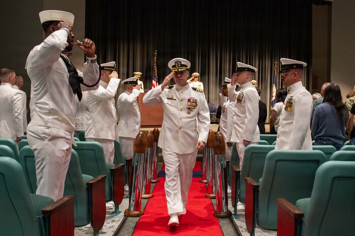 260604-N-MZ309-1225 KEYPORT, Wash. (June 4, 2026) Capt. Rob Garis departs a change of command ceremony at the U.S. Naval Undersea Museum in Keyport, Washington, June 4, 2026. During the ceremony Capt. Lacy Lodmell relieved Garis as commodore of Submarine Squadron (CSS) 19. CSS-19 is subordinate to Commander, Submarine Group (SUBGRU) 9 which exercises administrative and operational control of assigned submarine commands and units in the Pacific Northwest, providing oversight for shipboard training, personnel, and the supply and material readiness of SSBNs and their crews. SUBGRU-9 is also responsible for nuclear submarines undergoing conversion or overhaul at Puget Sound Naval Shipyard in Bremerton. (U.S. Navy photo by Mass Communication Specialist 1st Class Ryan Riley)