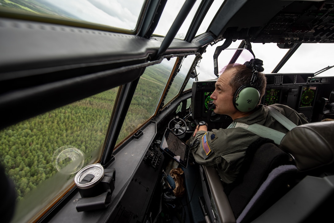 U.S. Air Force Lt. Col. Tristan Stonger, a pilot assigned to the 123rd Airlift Wing, Kentucky Air National Guard, flies a C-130J Super Hercules aircraft in the airspace above Karup, Denmark, June 4, 2026. The 123rd AW is providing tactical airlift support to NATO Allies throughout the month of June as part of Ramstein Flag 2026, an Allied Air Command large-scale, air-focused, multi-location and joint operating area exercise that kicks off June 8 with 18 participating nations and more than 200 aircraft. (U.S. Air National Guard photo by Master Sgt. Joshua Horton)