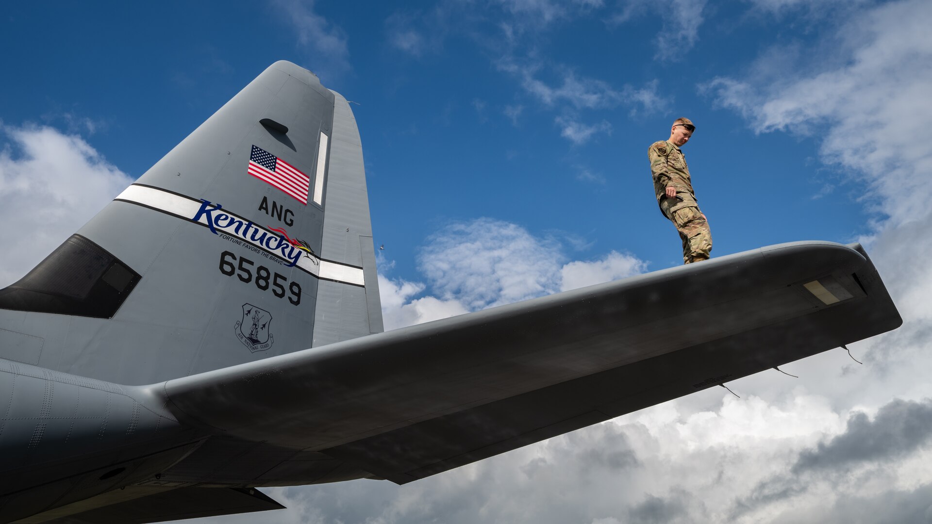 U.S. Air Force Staff Sgt. Tyler Pierce, a crew chief assigned to the 123rd Airlift Wing, Kentucky Air National Guard, inspects the fuselage of a C-130J Super Hercules aircraft at Karup Air Base, Denmark, June 4, 2026. The 123rd AW is providing tactical airlift support to NATO Allies throughout the month of June in support of Ramstein Flag 2026, an Allied Air Command large-scale, air-focused, multi-location and joint operating area exercise that kicks off June 8 with 18 participating nations and more than 200 aircraft. (U.S. Air National Guard photo by Lt. Col. Dale Greer)