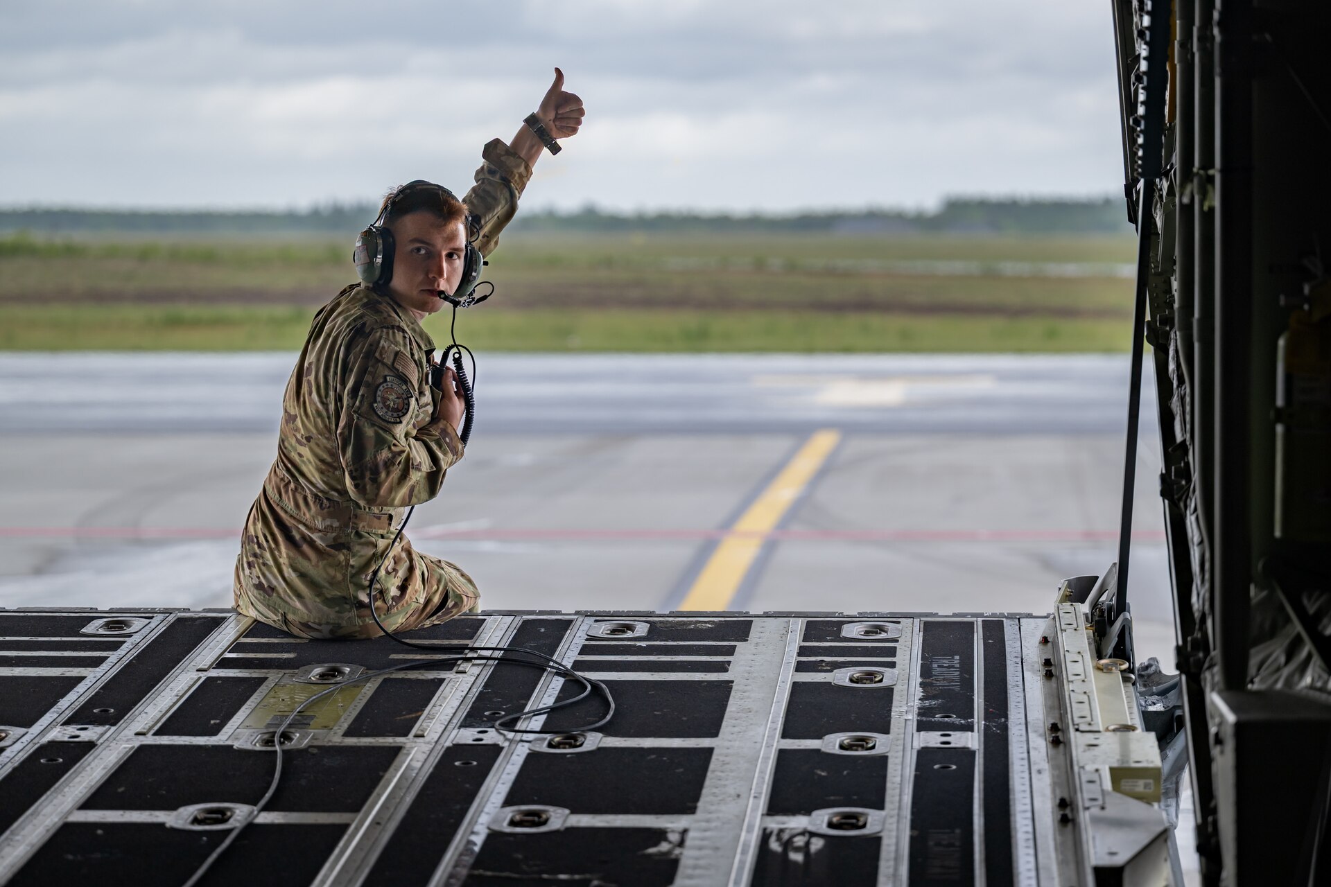U.S. Air Force Staff Sgt. Charles Vincent, a loadmaster assigned to the 123rd Airlift Wing, Kentucky Air National Guard, gives the thumb’s-up during a C-130J Super Hercules aircraft pre-flight checklist prior to takeoff from Karup Air Base, Denmark, on June 4, 2026. The 123rd AW is providing tactical airlift support to NATO Allies throughout the month of June in support of Ramstein Flag 2026, an Allied Air Command large-scale, air-focused, multi-location and joint operating area exercise that kicks off June 8 with 18 participating nations and more than 200 aircraft. (U.S. Air National Guard photo by Lt. Col. Dale Greer)