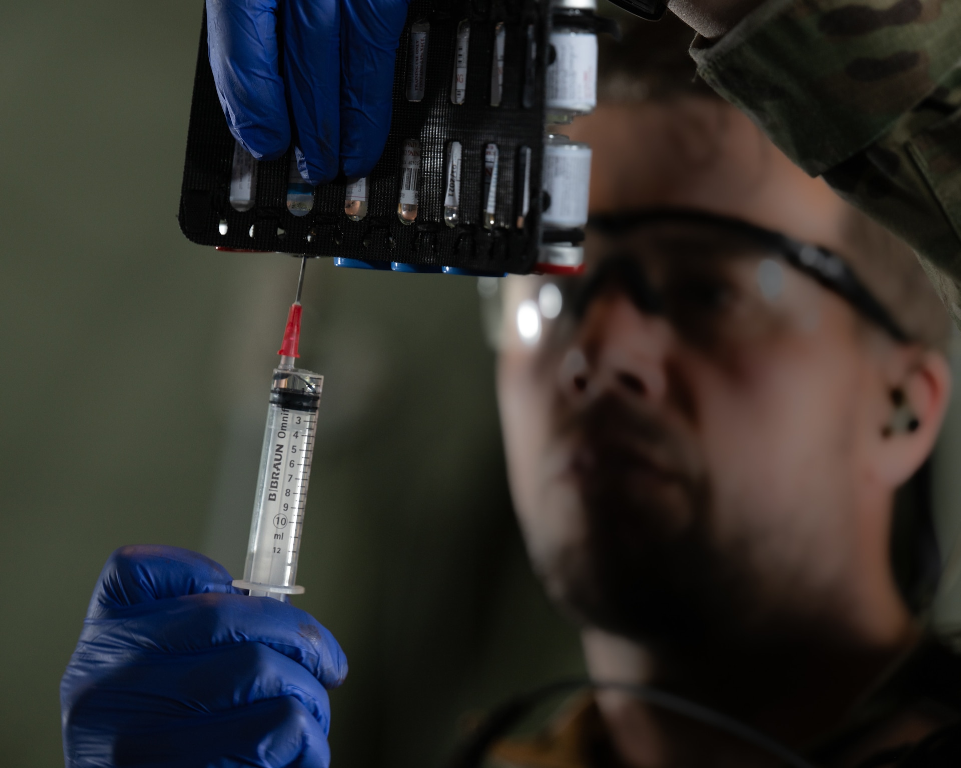 A medic with the Danish Armed Services prepares a syringe during an aeromedical evacuation exercise aboard a U.S. Air Force C-130J Super Hercules aircraft assigned to the 123rd Airlift Wing, Kentucky Air National Guard, while flying over Denmark on June 4, 2026. The 123rd AW is providing tactical airlift support to NATO Allies throughout the month of June in support of Ramstein Flag 2026, an Allied Air Command large-scale, air-focused, multi-location and joint operating area exercise that kicks off June 8 with 18 participating nations and more than 200 aircraft. (U.S. Air National Guard photo by Lt. Col. Dale Greer)