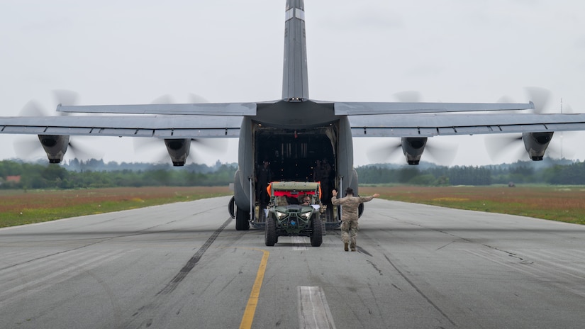 A U.S. Air Force loadmaster with the 123rd Airlift Wing, Kentucky Air National Guard, directs the onloading of a tactical vehicle onto a C-130J Super Hercules aircraft at Sindal Airport in Sindal, Denmark, June 3, 2026, as part of a personnel search-and-recovery training scenario conducted with the Danish Armed Forces. The 123rd AW is providing tactical airlift support to NATO Allies throughout the month of June in support of Ramstein Flag 2026, an Allied Air Command large-scale, air-focused, multi-location and joint operating area exercise with 18 participating nations and more than 200 aircraft. (U.S. Air National Guard photo by Lt. Col. Dale Greer)
