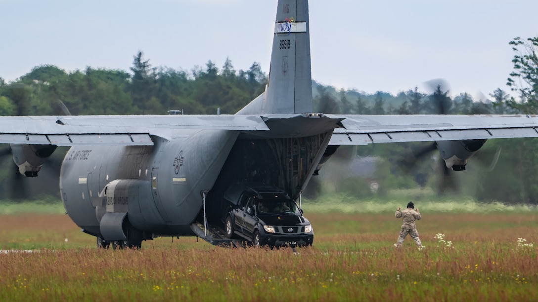 A U.S. Air Force loadmaster with the 123rd Airlift Wing, Kentucky Air National Guard, guides members of a Danish Armed Forces Air Mobility Personnel Recovery team as they drive off a U.S. Air Force C-130J Super Hercules aircraft at Sindal Airport in Sindal, Denmark, June 3, 2026, as part of a search-and-recovery training scenario. The 123rd AW is providing tactical airlift support to NATO Allies throughout the month of June in support of Ramstein Flag 2026, an Allied Air Command large-scale, air-focused, multi-location and joint operating area exercise with 18 participating nations and more than 200 aircraft. (U.S. Air National Guard photo by Lt. Col. Dale Greer)