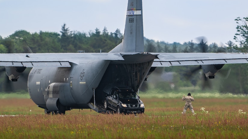 A U.S. Air Force loadmaster with the 123rd Airlift Wing, Kentucky Air National Guard, guides members of a Danish Armed Forces Air Mobility Personnel Recovery team as they drive off a U.S. Air Force C-130J Super Hercules aircraft at Sindal Airport in Sindal, Denmark, June 3, 2026, as part of a search-and-recovery training scenario. The 123rd AW is providing tactical airlift support to NATO Allies throughout the month of June in support of Ramstein Flag 2026, an Allied Air Command large-scale, air-focused, multi-location and joint operating area exercise with 18 participating nations and more than 200 aircraft. (U.S. Air National Guard photo by Lt. Col. Dale Greer)