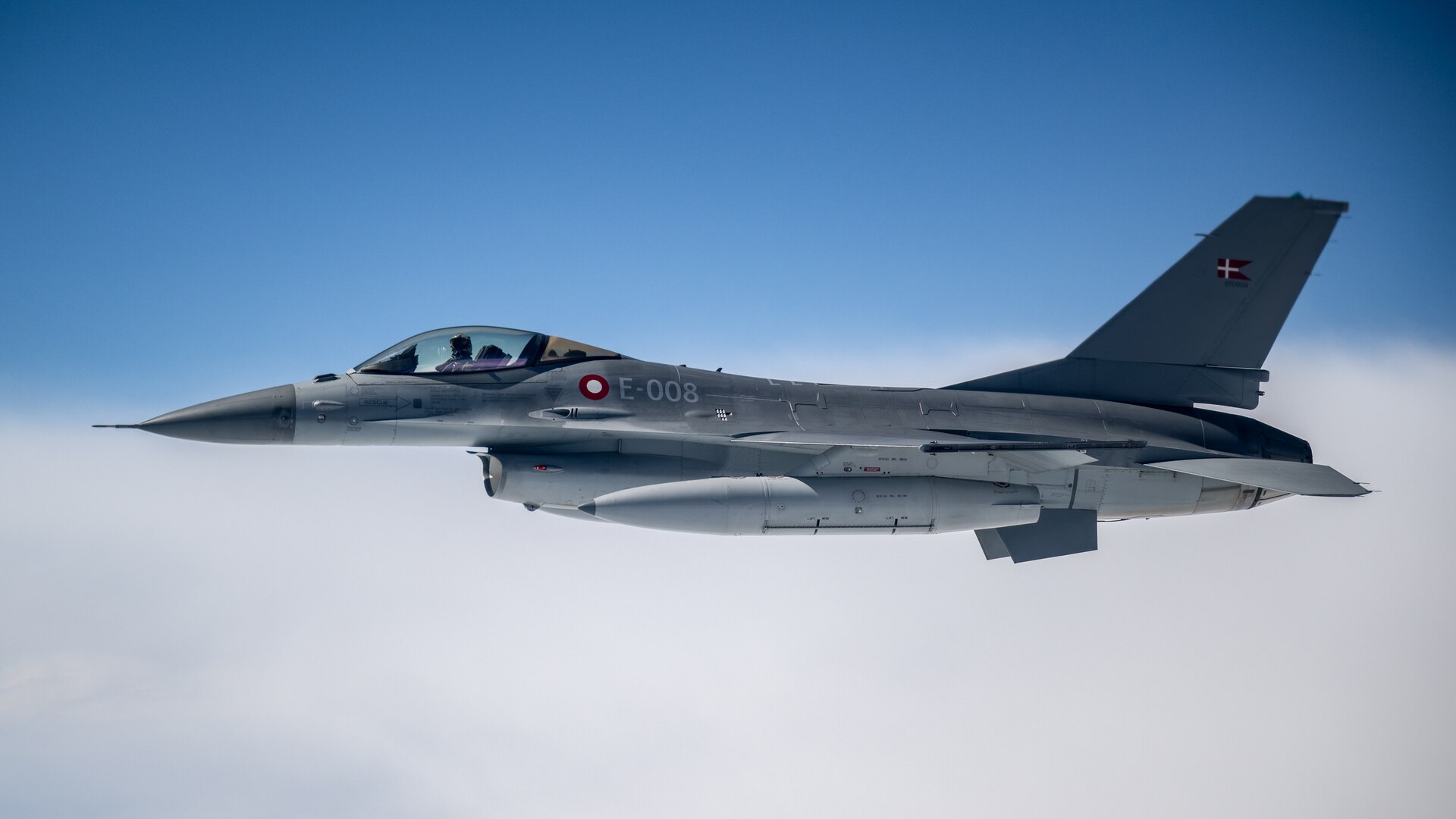 A Danish Air Force F-16 escorts a U.S. Air Force C-130J Super Hercules aircraft assigned to the 123rd Airlift Wing, Kentucky Air National Guard, during a training exercise over Denmark on June 4, 2026. The 123rd AW is providing tactical airlift support to NATO Allies throughout the month of June in support of Ramstein Flag 2026, an Allied Air Command large-scale, air-focused, multi-location and joint operating area exercise that kicks off June 8 with 18 participating nations and more than 200 aircraft. (U.S. Air National Guard photo by Lt. Col. Dale Greer)