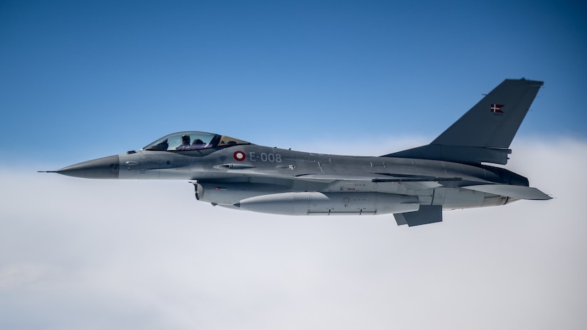 A Danish Air Force F-16 escorts a U.S. Air Force C-130J Super Hercules aircraft assigned to the 123rd Airlift Wing, Kentucky Air National Guard, during a training exercise over Denmark on June 4, 2026. The 123rd AW is providing tactical airlift support to NATO Allies throughout the month of June in support of Ramstein Flag 2026, an Allied Air Command large-scale, air-focused, multi-location and joint operating area exercise that kicks off June 8 with 18 participating nations and more than 200 aircraft. (U.S. Air National Guard photo by Lt. Col. Dale Greer)