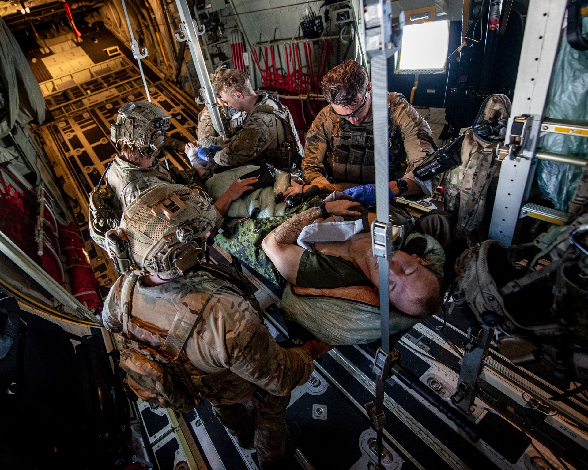 Members of the Danish Armed Forces conduct medical training aboard a U.S. Air Force C-130J Super Hercules aircraft assigned to the 123rd Airlift Wing, Kentucky Air National Guard, while flying over Denmark on June 4, 2026. The 123rd AW is providing tactical airlift support to NATO Allies throughout the month of June as part of Ramstein Flag 2026, an Allied Air Command large-scale, air-focused, multi-location and joint operating area exercise that kicks off June 8 with 18 participating nations and more than 200 aircraft. (U.S. Air National Guard photo by Master Sgt. Joshua Horton)