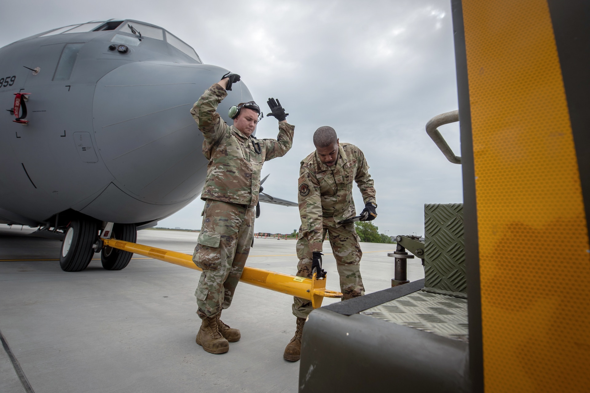U.S. Airmen with the 123rd Airlift Wing, Kentucky Air National Guard, reposition a C-130J Super Hercules aircraft using a tow tractor on the flight line at Karup Air Base, Denmark, June 2, 2026. The 123rd AW is providing tactical airlift support to NATO Allies throughout the month of June in support of Ramstein Flag 2026, an Allied Air Command large-scale, air-focused, multi-location and joint operating area exercise with 18 participating nations and more than 200 aircraft. (U.S. Air National Guard photo by Master Sgt. Joshua Horton)