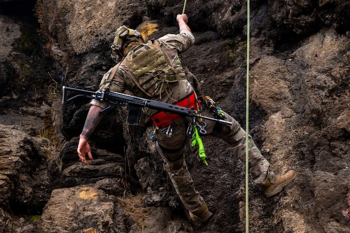 A U.S. Airman U.S. Airmen from the 492nd Special Operations Wing rappels down a cliff face during training at the Escuela Militar de Montaña in Bariloche, Argentina.