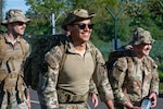 Pathfinders smile while participating in a Police Week ruck march at RAF Fairford, England, May 12, 2026. The event was held in recognition of National Police Week, honoring the dedication, service and sacrifice of law enforcement personnel and Defenders. (U.S. Air Force photo by Senior Airman Adam Enbal)