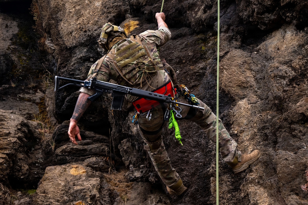 A U.S. Airman U.S. Airmen from the 492nd Special Operations Wing rappels down a cliff face during training at the Escuela Militar de Montaña in Bariloche, Argentina.