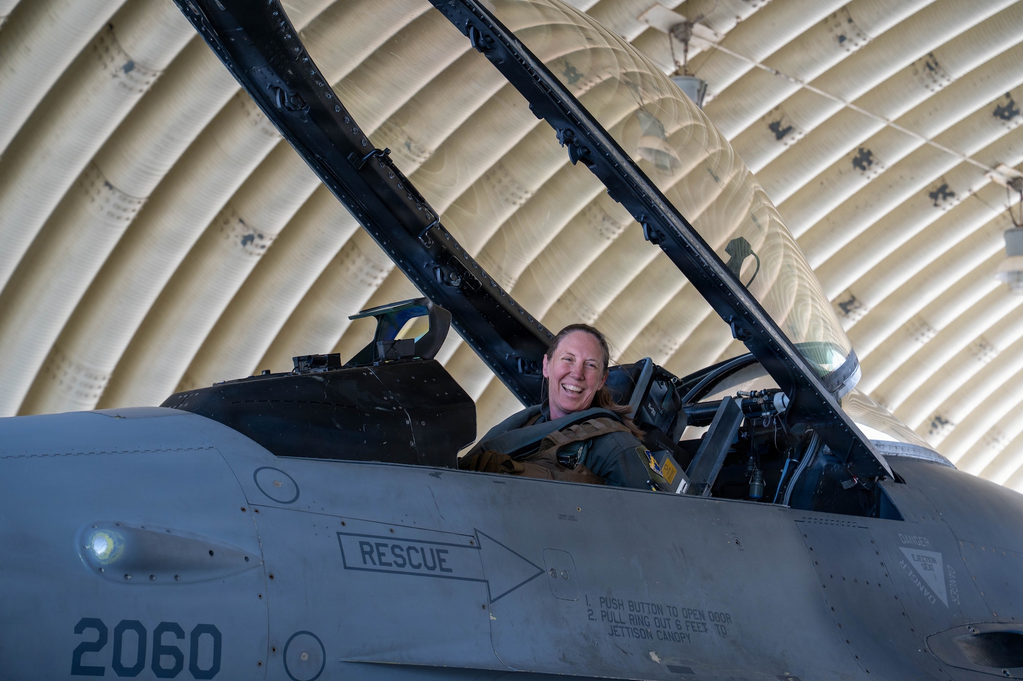 U.S. Air Force Col. Kathryn “Wolf” Gaetke, 8th Fighter Wing commander sits in cockpit.