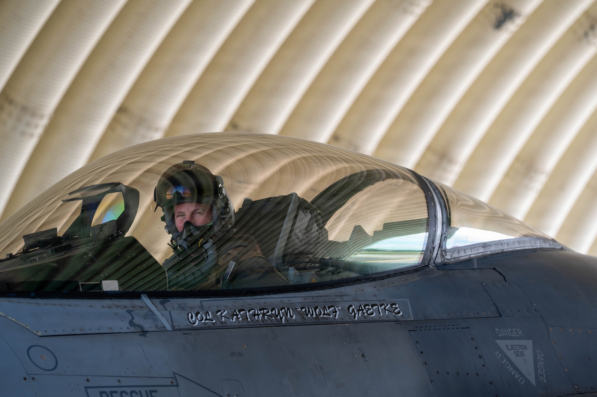 U.S. Air Force Col. Kathryn “Wolf” Gaetke, 8th Fighter Wing commander sits in cockpit.