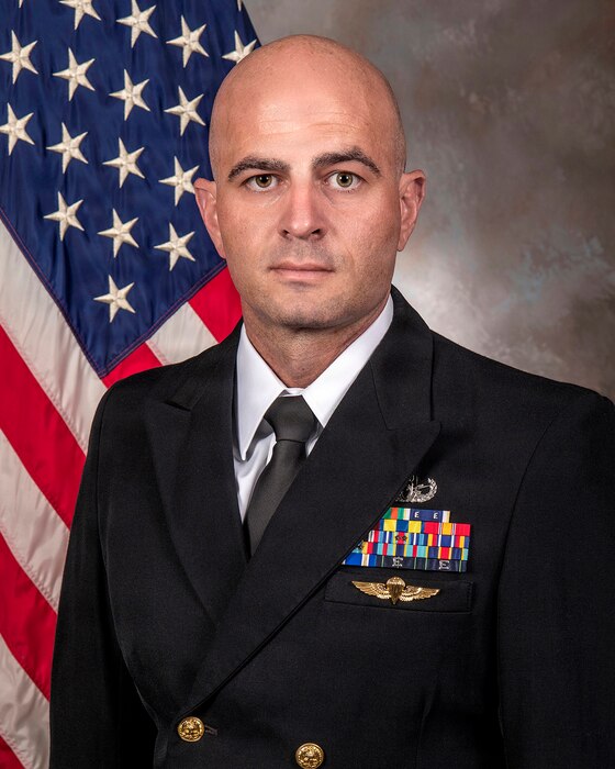 Navy Lt. j.g. Drew Murray, a nurse assigned to U.S. Naval Hospital (USNH) Guam, poses for an official photo. Murray recently earned recognition as a recipient of the 2025 Military health System (MHS) Nursing Leadership Excellence Award in the junior military category.