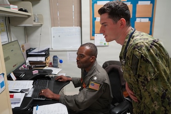 Ensign Connor Mangan, a fourth-year medical student at the Uniformed Services University of the Health Sciences, works alongside Cmdr. Jean Mathurin, a flight medicine physician, at U.S. Naval Hospital Rota, Spain, during an Advanced Clerkship Rotation. The rotation provides future Navy physicians opportunities to develop clinical skills and gain firsthand experience supporting Navy Medicine’s operational readiness mission. (U.S. Navy photo by Lt. Cmdr. Alicia Sacks)