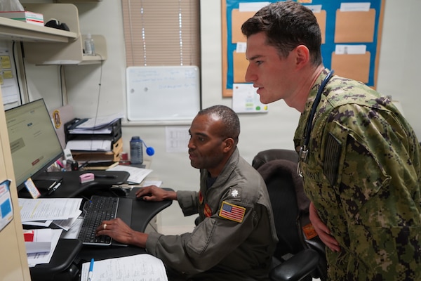 Ensign Connor Mangan, a fourth-year medical student at the Uniformed Services University of the Health Sciences, works alongside Cmdr. Jean Mathurin, a flight medicine physician, at U.S. Naval Hospital Rota, Spain, during an Advanced Clerkship Rotation. The rotation provides future Navy physicians opportunities to develop clinical skills and gain firsthand experience supporting Navy Medicine’s operational readiness mission. (U.S. Navy photo by Lt. Cmdr. Alicia Sacks)