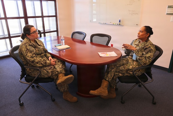 Lt. Catherine "Nicole" Thomas (left), department head of Navy Medicine Readiness and Training Detachment Bridgeport, speaks with Capt. Janiese Cleckley, commanding officer of Navy Medicine Readiness and Training Command Twentynine Palms, during NMRTC Twentynine Palms' "CO for a Day" program May 21, 2026. The program provides officers an opportunity to gain insight into executive leadership, command operations and strategic decision-making within Navy Medicine. (U.S. Navy photo by Christopher Jones, NMRTC/NH Twentynine Palms public affairs officer)