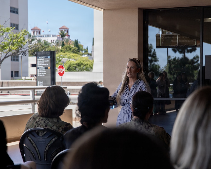 Jennifer Deer, Naval Medical Center San Diego Patient Relations department head, addresses the crowd during the grand opening of the Patient Advocacy and Resource Center, at NMCSD, June 9. The PARC enhances warfighter readiness by centralizing resources such as patient advocates, beneficiary counseling, and referral navigation experts into one dedicated physical space, minimizing delays to issue resolution. NMCSD employs more than 5,500 active-duty military personnel, civilians, and contractors in Southern California to deliver exceptional care afloat and ashore. (U.S. Navy photo by Mass Communication Specialist 3rd Class Jason Afable)