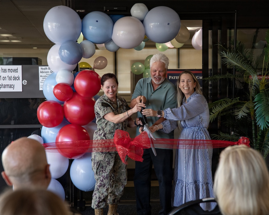 U.S. Navy Capt. Elizabeth Adriano, director, Naval Medical Center San Diego, Jeff Apana, former NMCSD Patient Relations department head, and Jennifer Deer, NMCSD Patient Relations department head, perform the ceremonial ribbon-cutting during the grand opening of the Patient Advocacy and Resource Center, at NMCSD, June 9. The new facility unifies patient relations personnel and resources into one centralized hub. NMCSD employs more than 5,500 active-duty military personnel, civilians, and contractors in Southern California to deliver exceptional care afloat and ashore. (U.S. Navy photo by Mass Communication Specialist 3rd Class Jason Afable)