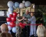 U.S. Navy Capt. Elizabeth Adriano, director, Naval Medical Center San Diego, Jeff Apana, former NMCSD Patient Relations department head, and Jennifer Deer, NMCSD Patient Relations department head, perform the ceremonial ribbon-cutting during the grand opening of the Patient Advocacy and Resource Center, at NMCSD, June 9. The new facility unifies patient relations personnel and resources into one centralized hub. NMCSD employs more than 5,500 active-duty military personnel, civilians, and contractors in Southern California to deliver exceptional care afloat and ashore. (U.S. Navy photo by Mass Communication Specialist 3rd Class Jason Afable)