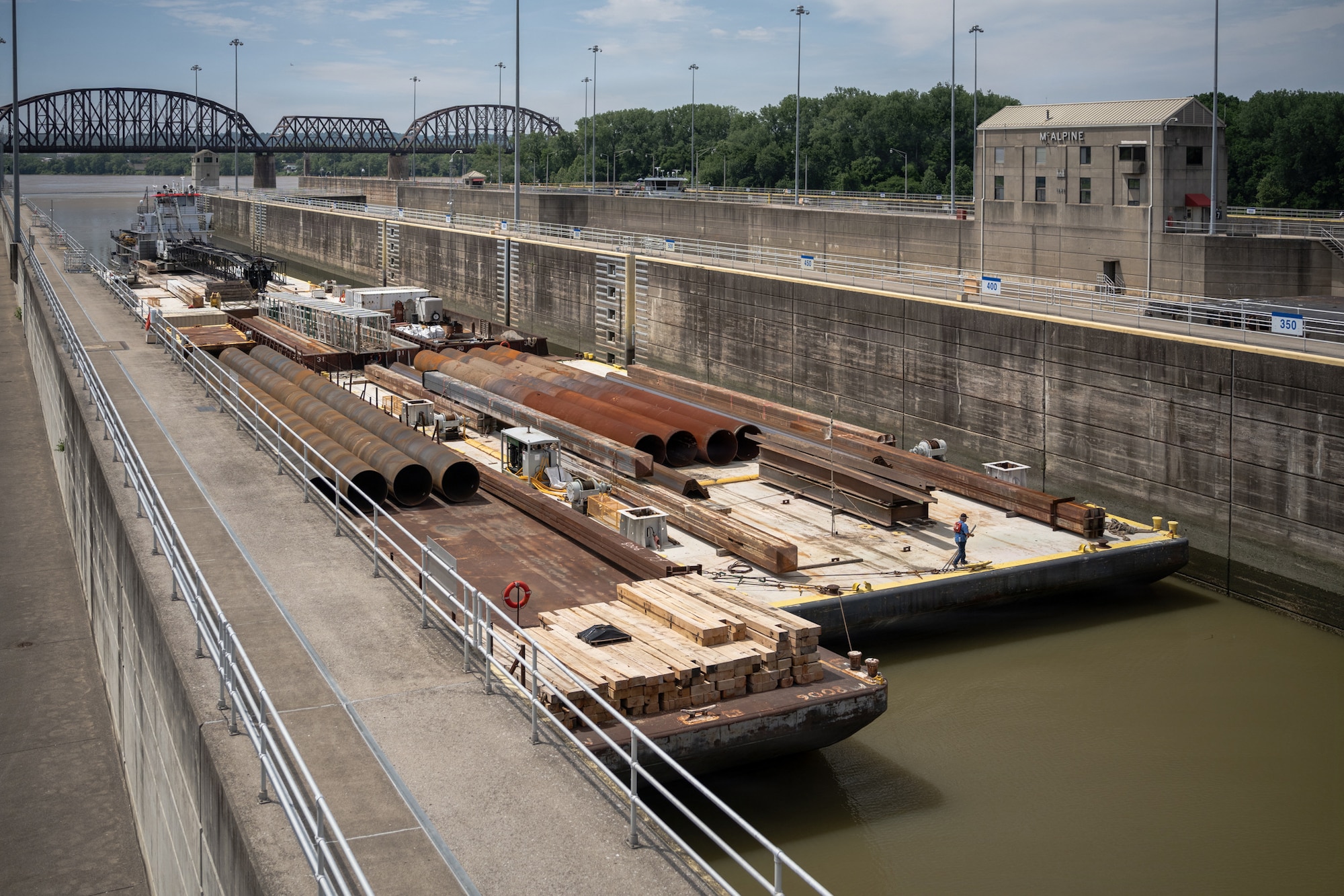 The M/V Elizabeth Ann locks through McAlpine Locks and Dam with a heavy crane bound from St. Louis to Cincinnati, May 30, 2026 in Louisville, Kentucky. The Ohio Department of Transportation worked with USACE to provide imagery of the trip for an ODOT "barge watch" public engagement campaign.