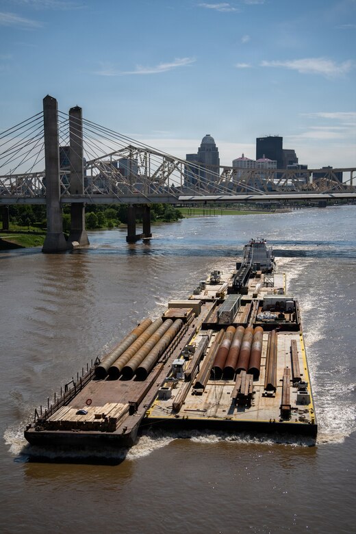 The M/V Elizabeth Ann passes downtown Louisville after locking through McAlpine Locks and Dam with a heavy crane bound from St. Louis to Cincinnati, May 30, 2026 in Louisville, Kentucky. The Ohio Department of Transportation worked with USACE to provide imagery of the trip for an ODOT "barge watch" public engagement campaign.