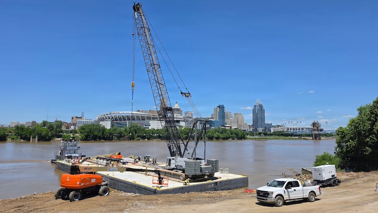 A heavy crane is set up after being transported by the M/V Elizabeth Ann, which traveled from St. Louis to Cincinnati, June 2, 2026 in Cincinnati, Ohio. The Ohio Department of Transportation worked with USACE to provide imagery of the trip for an ODOT "barge watch" public engagement campaign.