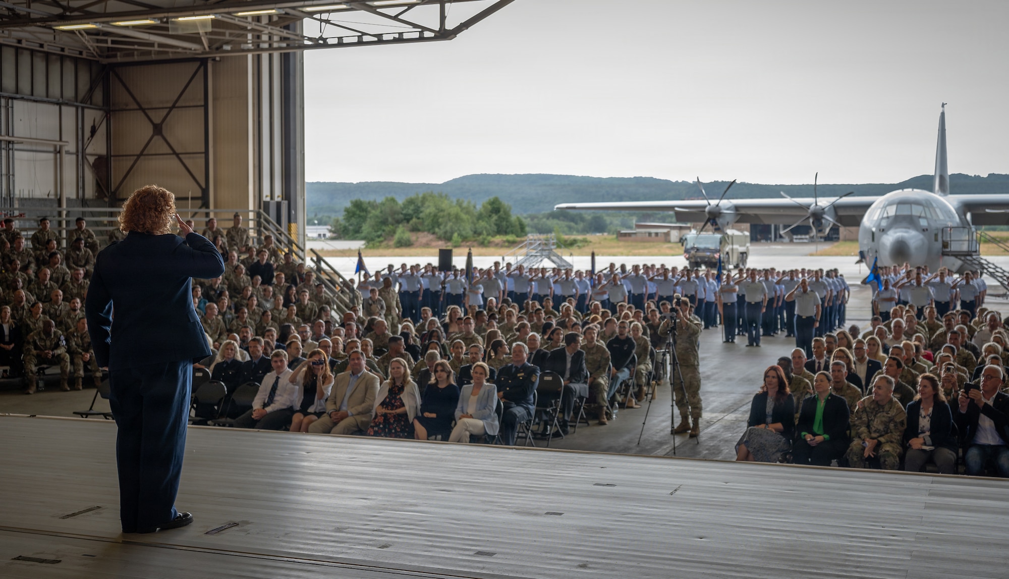 A photo of a commander rendering a final salute
