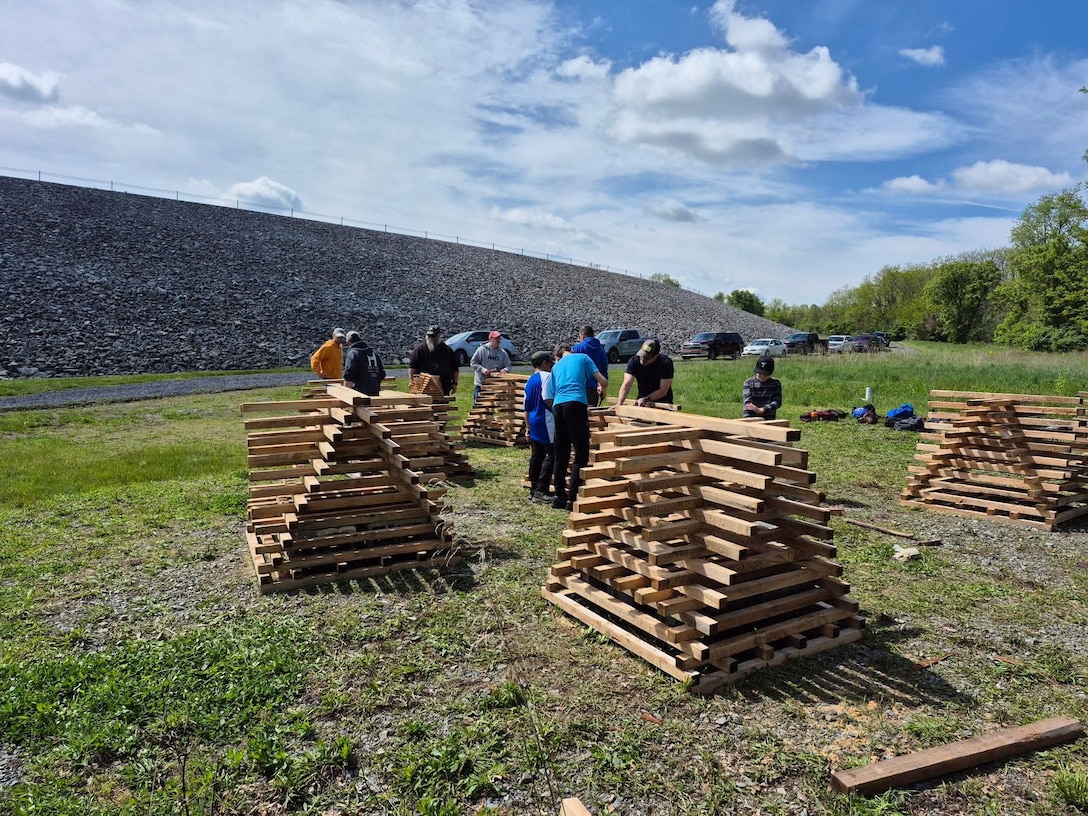 Volunteers help build fish habitat structure.