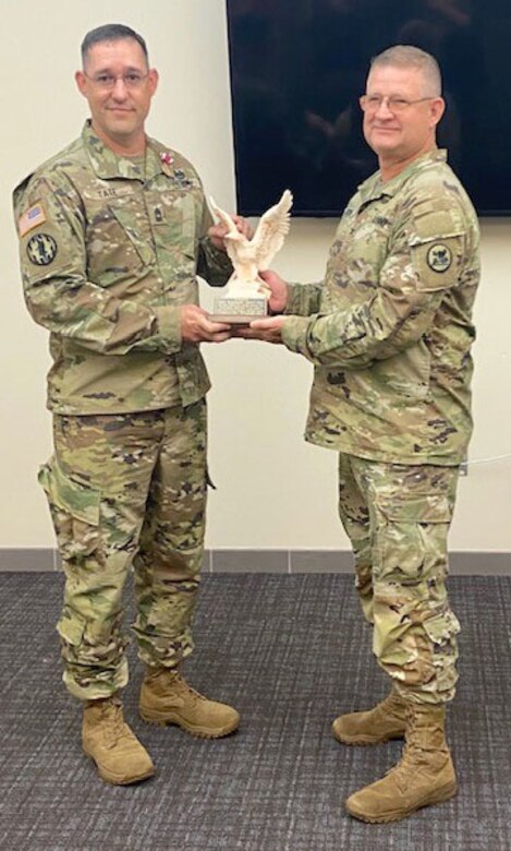 Picture of a solder giving another solder an award.