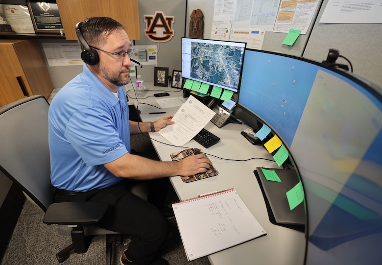 Picture of a man working at a computer