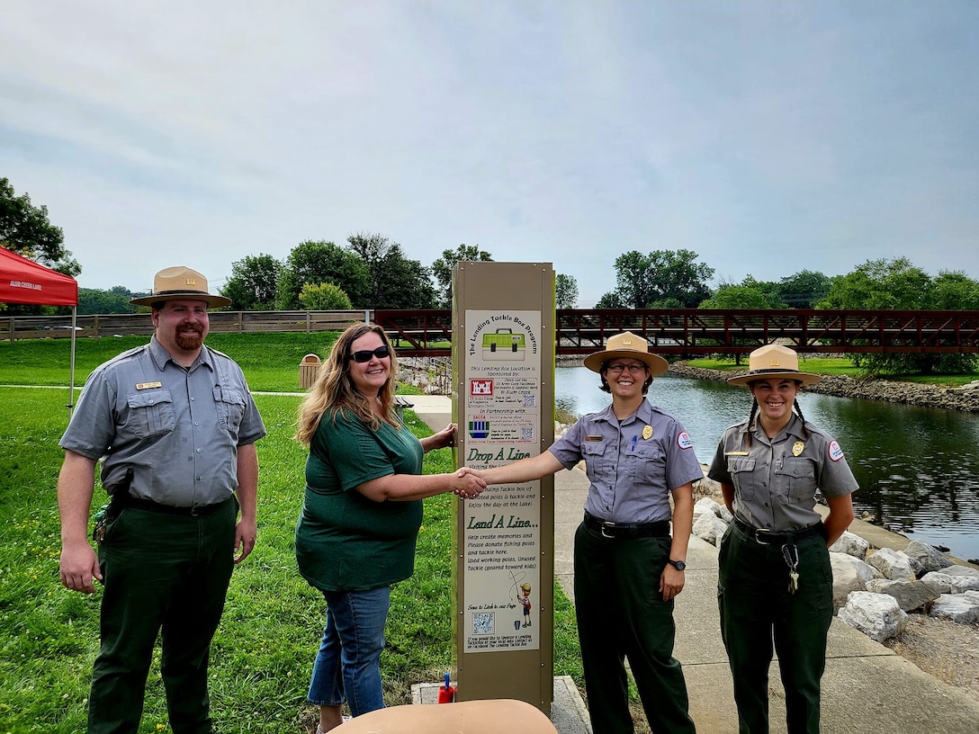 Alum Creek Park Rangers and partner pose for a photo for their tackle box program.