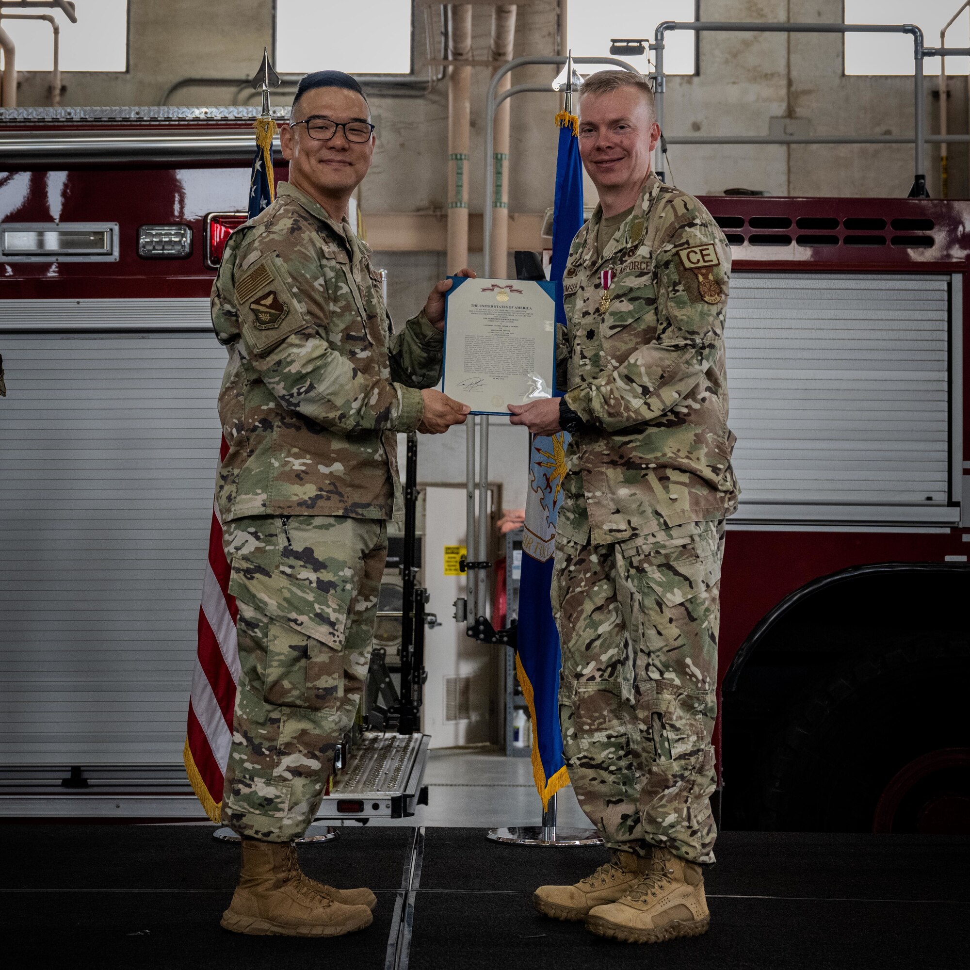 U.S. Air Force Col. Peter Joo, 47th Mission Support Group commander, presents the Meritorious Service certificate to Lt. Col. Nathan Thomsen, outgoing commander of the 47th Civil Engineer Squadron (CES), during the 47th CES change of command ceremony at Laughlin Air Force Base, Texas, June 9, 2026. The Meritorious Service Medal is a military award given to members of the United States Armed Forces who distinguish themselves through exceptional meritorious achievement or service to the nation. (U.S. Air Force photo by Airman 1st Class Harrison Sullivan)