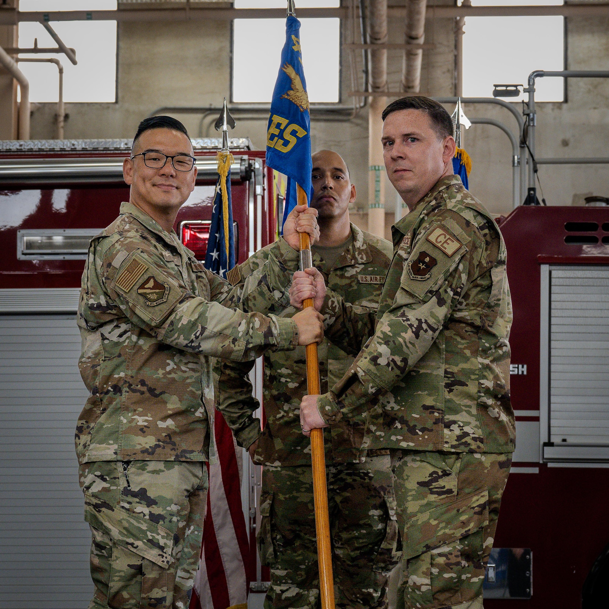 U.S. Air Force Lt. Col. Benjamin Johnson, 47th Civil Engineer Squadron incoming commander, accepts the 47th CES guidon from Col. Peter Joo, 47th Mission Support Group commander, during the 47th CES change of command ceremony at Laughlin Air Force Base, Texas, June 9, 2026. The passing of the guidon to Johnson signifies his acceptance of command of the 47th CES. (U.S. Air Force photo by Airman 1st Class Harrison Sullivan)
