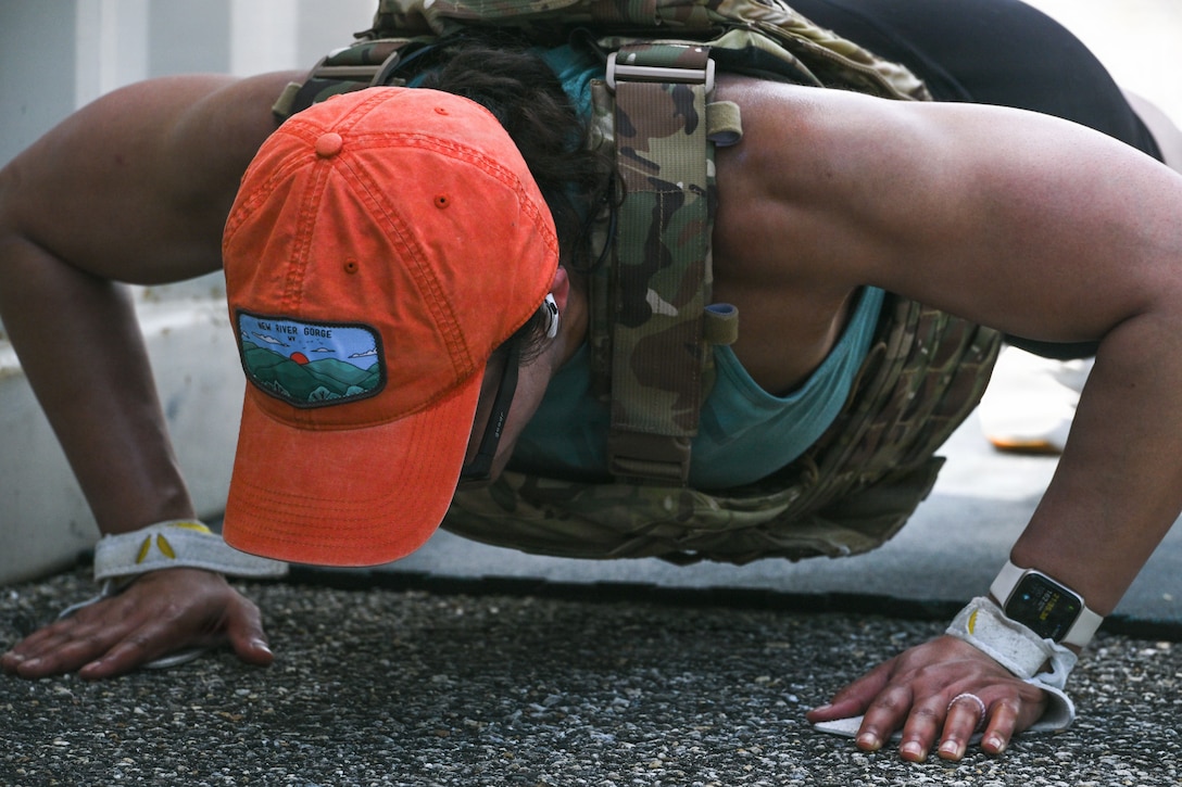 U.S. Air Force Maj. Krystal Price, Andrews Medical Support Squadron Tricare Operations and Patient Administration flight commander, conducts push-ups during the Murph Challenge at Joint Base Andrews, Maryland, June 5, 2026.