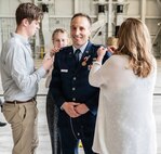 The family of Brig. Gen. Brian Jusseaume pins on his stars during his promotion ceremony June 7 at Pease Air National Guard Base in Newington. Jusseaume succeeded Brig. Gen. Bill Davis as the commander of the New Hampshire Air National Guard. Photo by Tech. Sgt. April Jackson, 157th ARW Public Affairs.