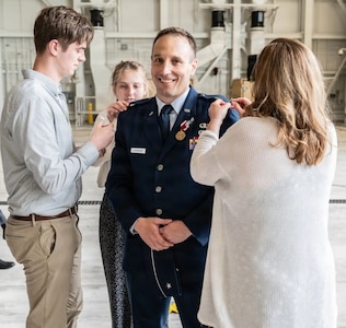The family of Brig. Gen. Brian Jusseaume pins on his stars during his promotion ceremony June 7 at Pease Air National Guard Base in Newington. Jusseaume succeeded Brig. Gen. Bill Davis as the commander of the New Hampshire Air National Guard. Photo by Tech. Sgt. April Jackson, 157th ARW Public Affairs.