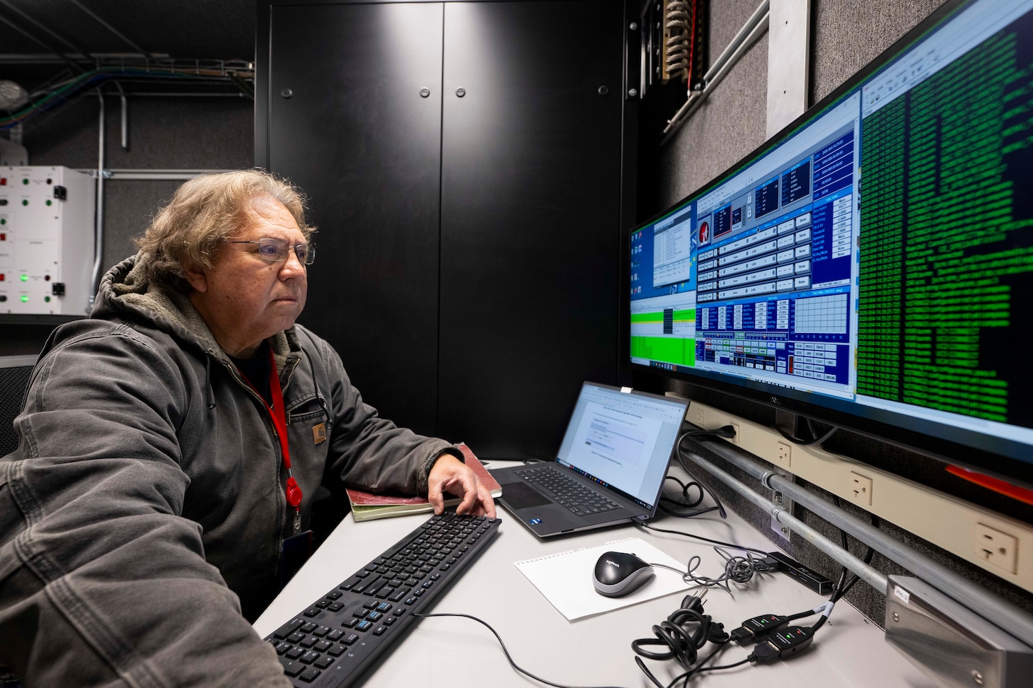 Tommy Munoz, L3 Harris integration test lead, calibrates a satellite tracking antenna system as it is transferred from the U.S. Space Force (USSF) to the U.S. Naval Research Laboratory (NRL) at the Blossom Point Tracking Facility in Welcome, Md. March 5, 2026. NRL and USSF partnered to support expanded joint testing and operational readiness for space systems, reinforcing collaboration between the naval and space communities. (U.S. Navy photo by Sarah Peterson)