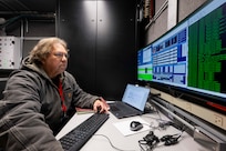 Tommy Munoz, L3 Harris integration test lead, calibrates a satellite tracking antenna system as it is transferred from the U.S. Space Force (USSF) to the U.S. Naval Research Laboratory (NRL) at the Blossom Point Tracking Facility in Welcome, Md. March 5, 2026. NRL and USSF partnered to support expanded joint testing and operational readiness for space systems, reinforcing collaboration between the naval and space communities. (U.S. Navy photo by Sarah Peterson)