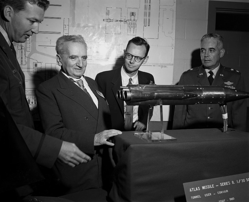 Theodore von Kármán, second from left, looks at a model of an Atlas missile tested in the wind tunnels of the von Kármán Gas Dynamics Facility at Arnold Air Force Base, Tenn., Oct. 30, 1959. The facility was dedicated in von Kármán’s honor on that same date. Von Kármán is credited with helping advance U.S. aerospace capabilities. (U.S. Air Force photo)