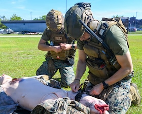Hospital Corpsman 2nd Class Jeremiah Muniz, right, assigned to 2nd Medical Battalion, Bravo Company, applies a tourniquet to a simulated casualty during an En Route care (ERC) training at the Healthcare Simulation and Bioskills Center, on June 5, 2026. The ERC program is designed to train hospital corpsmen on necessary en route care, integrating high-fidelity simulators and hands-on training. Final testing for the ERC course was hosted by the Naval Medical Center Healthcare Simulation and Bioskills Center  (U.S. Navy photo by Mass Communication Specialist 2nd Class Justin Woods)