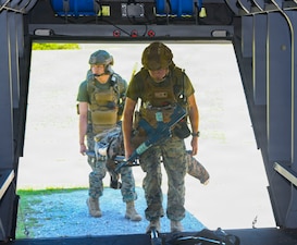 Hospital Corpsman 3rd Class Mats Zdon, front, assigned to 24th Marine Expeditionary Unit, and Hospital Corpsman 2nd Class Jeremiah Muniz, assigned to 2nd Medical Battalion, Bravo Company, transport a simulated casualty onto a V-22 Osprey simulator during an En Route care (ERC) training at the Healthcare Simulation and Bioskills Center, on June 5, 2026. The ERC program is designed to train hospital corpsmen on necessary en route care, integrating high-fidelity simulators and hands-on training. Final testing for the ERC course was hosted by the Naval Medical Center Healthcare Simulation and Bioskills Center  (U.S. Navy photo by Mass Communication Specialist 2nd Class Justin Woods)