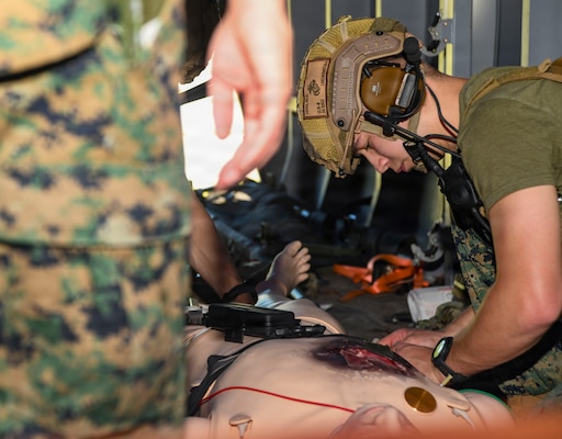 Hospital Corpsman 3rd Class Mats Zdon, assigned to 24th Marine Expeditionary Unit, inserts a chest tube into a simulated casualty during an En Route care (ERC) training at the Healthcare Simulation and Bioskills Center, on June 5, 2026. The ERC program is designed to train hospital corpsmen on necessary en route care, integrating high-fidelity simulators and hands-on training. Final testing for the ERC course was hosted by the Naval Medical Center Healthcare Simulation and Bioskills Center  (U.S. Navy photo by Mass Communication Specialist 2nd Class Justin Woods)