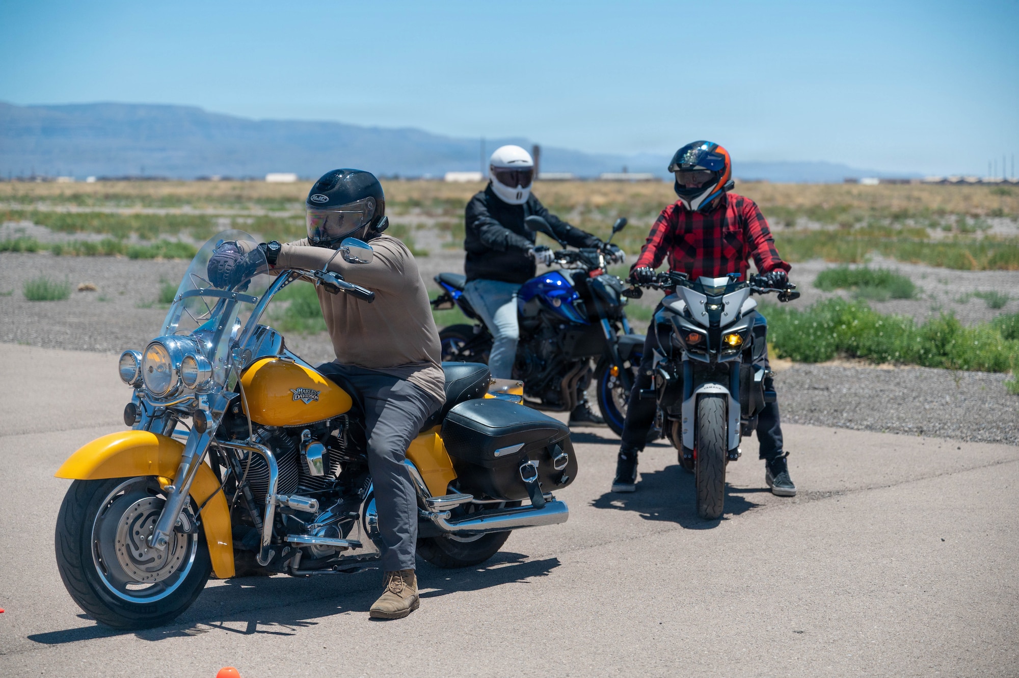 Motorcycle riders wait for instruction to proceed through an exercise during the Rider Mentor Program at Holloman Air Force Base, May 19, 2026.