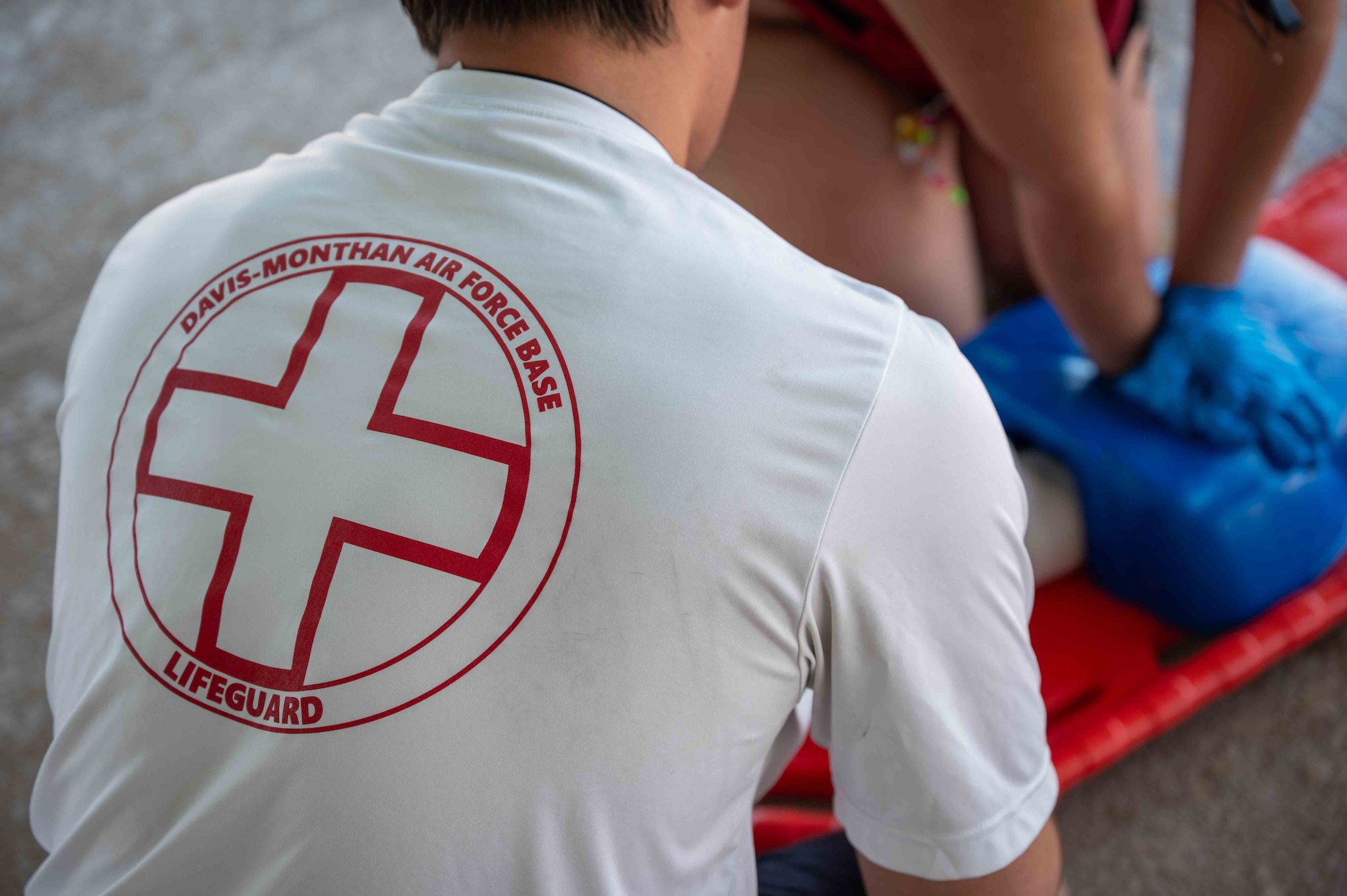 Lifeguards perform CPR.